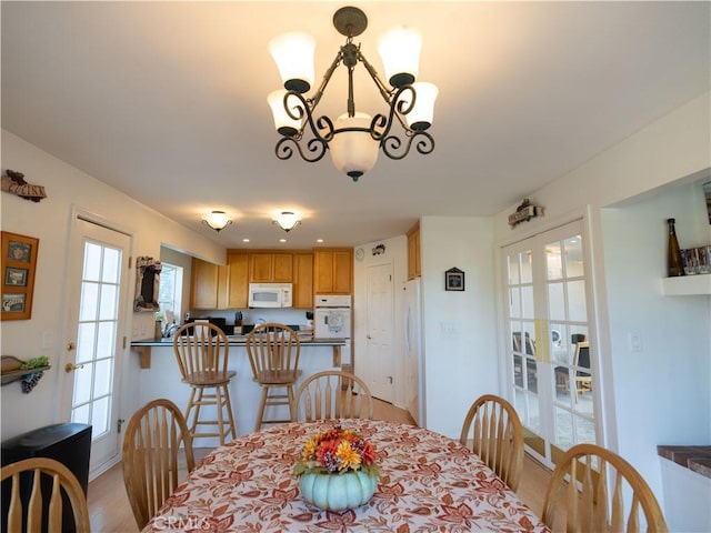 406 Delle Dr, Crestline, CA 92325 - dining space with a chandelier and light wood-style flooring