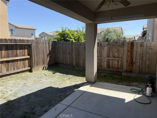 1019 El Molino Ave, Clovis, CA 93619 - view of yard featuring a patio area, a fenced backyard, and a ceiling fan