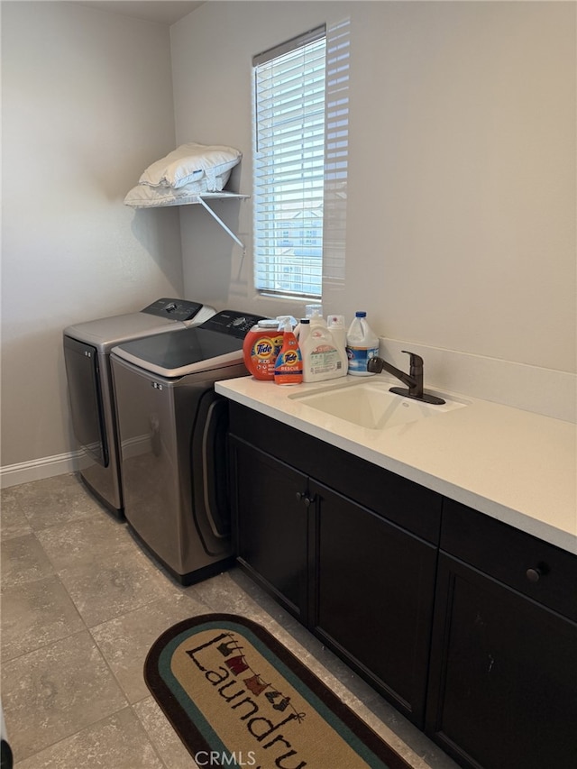 1019 El Molino Ave, Clovis, CA 93619 - clothes washing area featuring baseboards, separate washer and dryer, a sink, and cabinet space