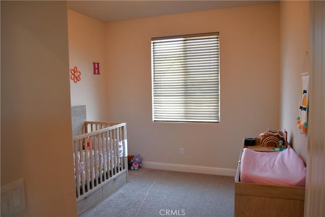 1019 El Molino Ave, Clovis, CA 93619 - bedroom featuring carpet floors, baseboards, multiple windows, and a nursery area