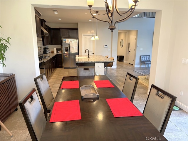 1019 El Molino Ave, Clovis, CA 93619 - dining room with baseboards, recessed lighting, and a chandelier