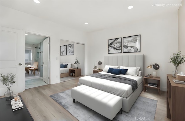 bedroom with recessed lighting, baseboards, and light wood-type flooring