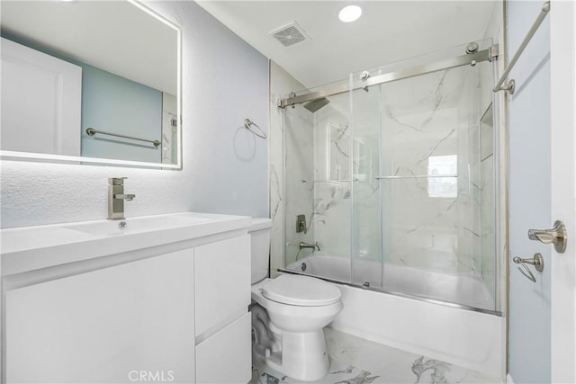 full bathroom featuring visible vents, vanity, marble finish floor, toilet, and combined bath / shower with glass door