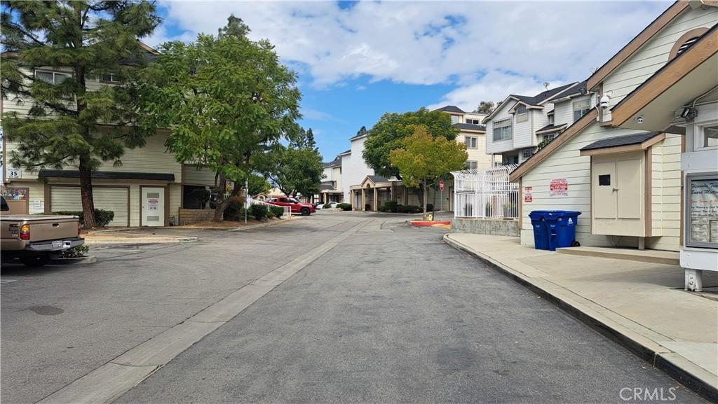 11150 Glenoaks Blvd Unit 106, Pacoima, CA 91331 - view of asphalt street featuring a residential view