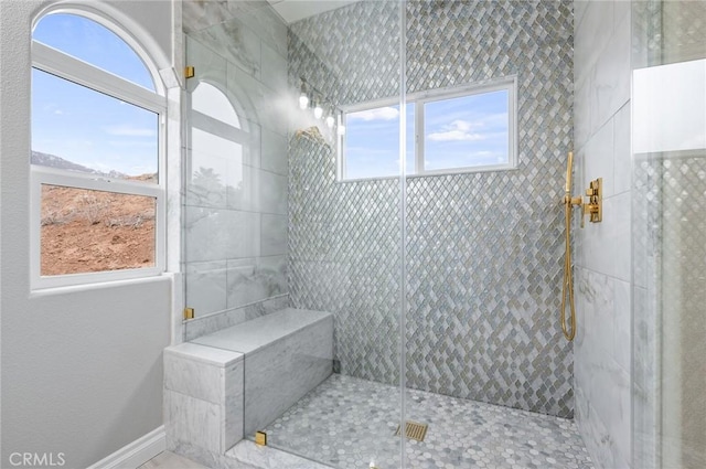 bathroom featuring tiled shower