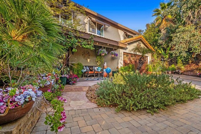 455 Ridgeview Ct, Bonita, CA 91902 - exterior space with a tiled roof, a patio, and stucco siding