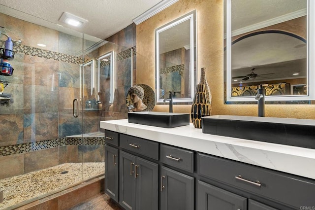 455 Ridgeview Ct, Bonita, CA 91902 - full bathroom with a sink, a textured ceiling, crown molding, double vanity, and a stall shower