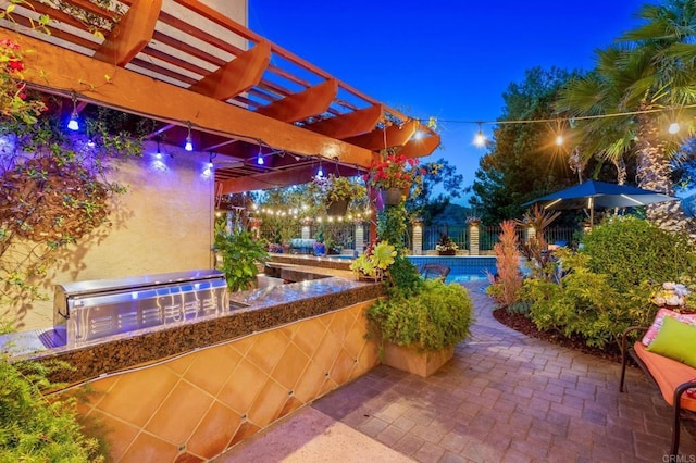 455 Ridgeview Ct, Bonita, CA 91902 - patio at twilight featuring an outdoor pool, an outdoor kitchen, and a pergola