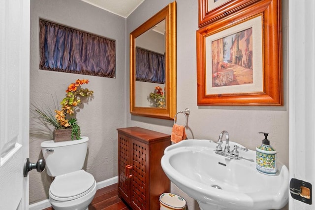 455 Ridgeview Ct, Bonita, CA 91902 - half bath featuring toilet, wood finished floors, a sink, a textured wall, and baseboards