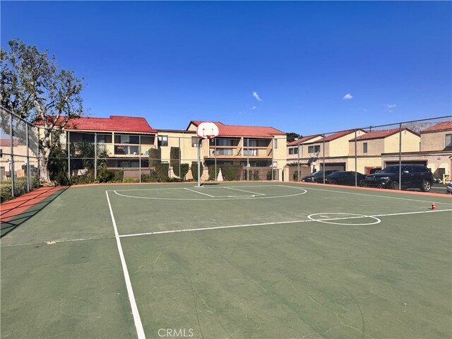 9208 Citrus Ave Unit C, Fontana, CA 92335 - view of basketball court featuring a residential view, fence, and community basketball court