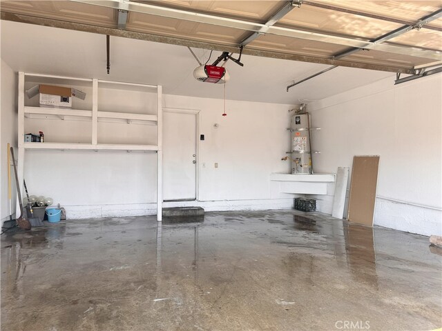 9208 Citrus Ave Unit C, Fontana, CA 92335 - garage featuring strapped water heater and a garage door opener