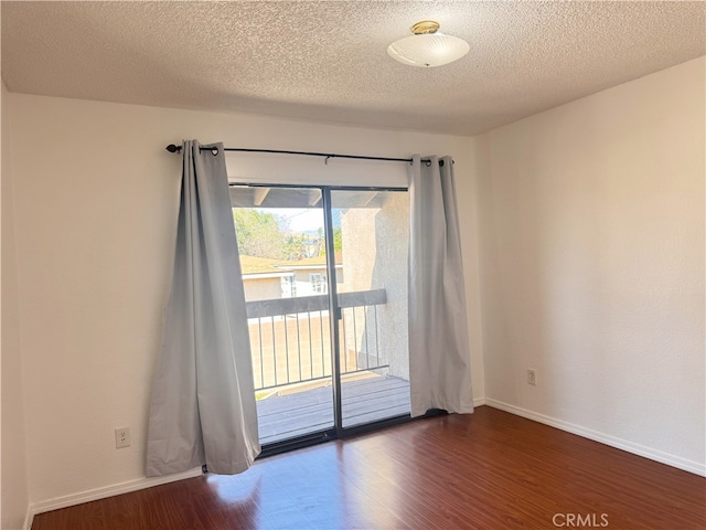 9208 Citrus Ave Unit C, Fontana, CA 92335 - spare room featuring dark wood-style flooring, baseboards, and a textured ceiling