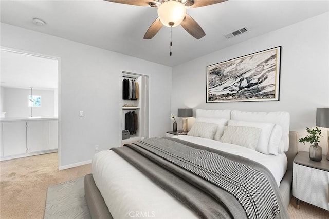 30754 Links Ct, Temecula, CA 92591 - bedroom featuring light carpet, a closet, baseboards, a ceiling fan, and a spacious closet