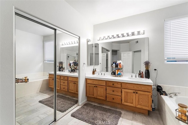 30754 Links Ct, Temecula, CA 92591 - full bath with double vanity, a bath, and a stall shower