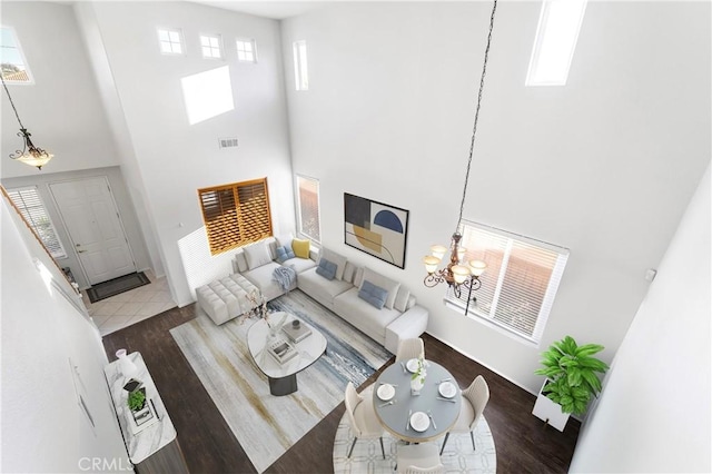 30754 Links Ct, Temecula, CA 92591 - living area featuring a towering ceiling, wood finished floors, and a chandelier