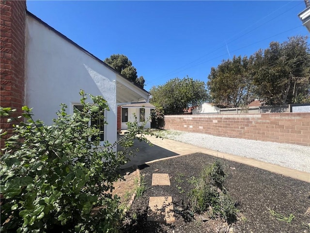 view of yard featuring a patio and a fenced backyard