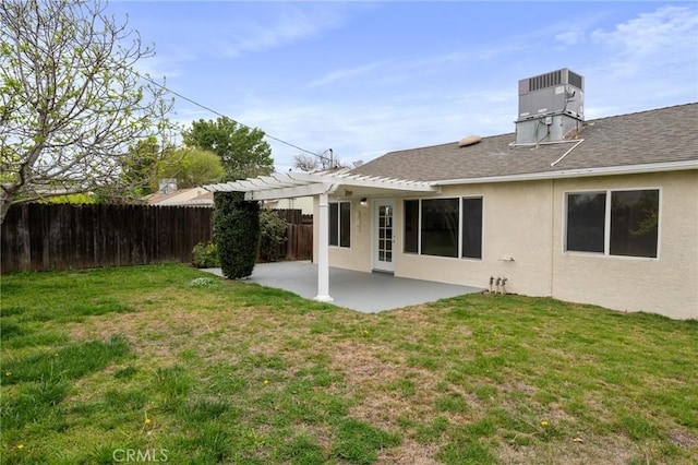 back of house featuring a pergola, a patio area, a yard, and fence