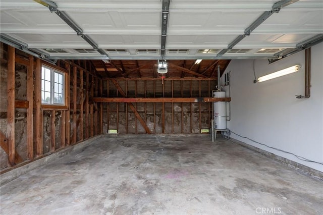 garage with water heater and a garage door opener
