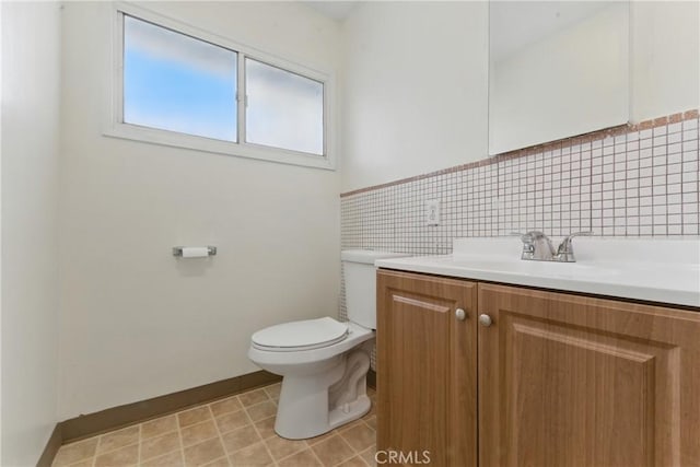 1114 Stovall Ave, La Puente, CA 91745 - bathroom featuring baseboards, toilet, and vanity