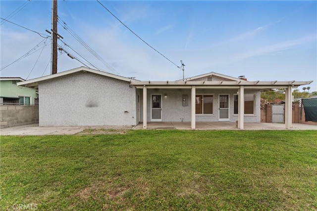 1114 Stovall Ave, La Puente, CA 91745 - back of house with fence, a patio area, a gate, and stucco siding