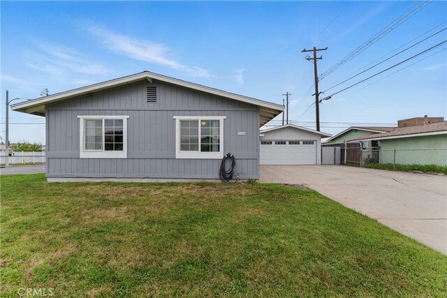 1114 Stovall Ave, La Puente, CA 91745 - view of front of property featuring fence, a front lawn, and a detached garage