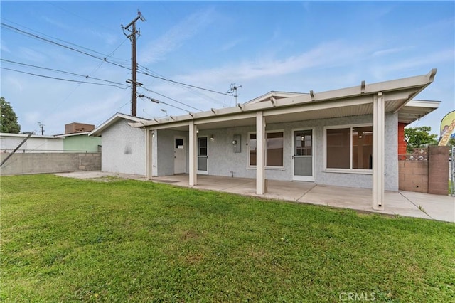 1114 Stovall Ave, La Puente, CA 91745 - back of house with a patio area, a fenced backyard, a yard, and stucco siding