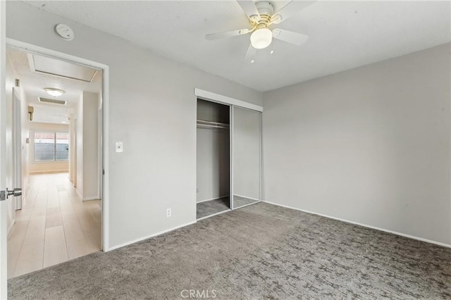 1114 Stovall Ave, La Puente, CA 91745 - unfurnished bedroom with a ceiling fan, carpet floors, a closet, baseboards, and attic access