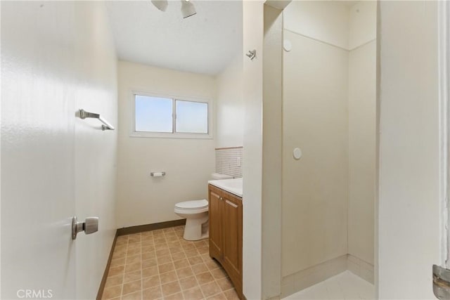 1114 Stovall Ave, La Puente, CA 91745 - bathroom with toilet, vanity, and baseboards