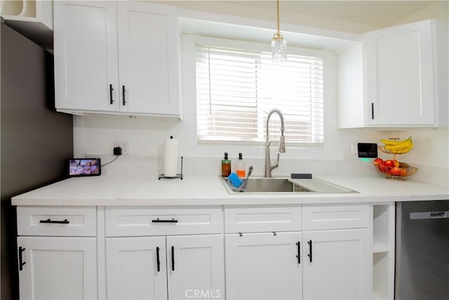 45522 Andale Ave, Lancaster, CA 93535 - kitchen featuring a sink, white cabinetry, dishwashing machine, and pendant lighting