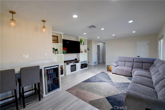 45522 Andale Ave, Lancaster, CA 93535 - living area featuring wine cooler, light wood finished floors, recessed lighting, and baseboards