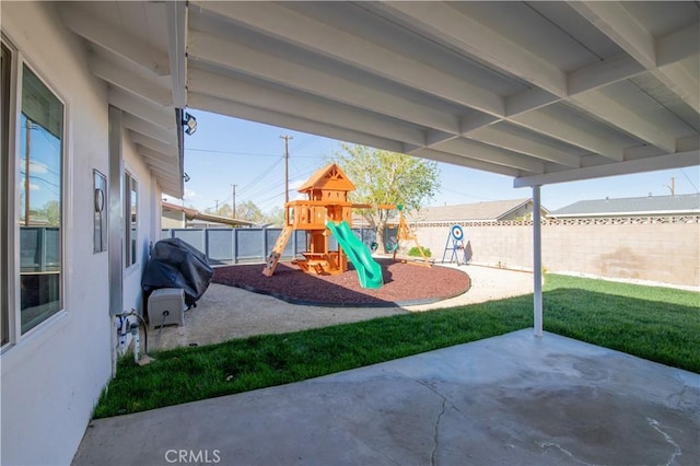 45522 Andale Ave, Lancaster, CA 93535 - view of patio / terrace featuring a playground and a fenced backyard