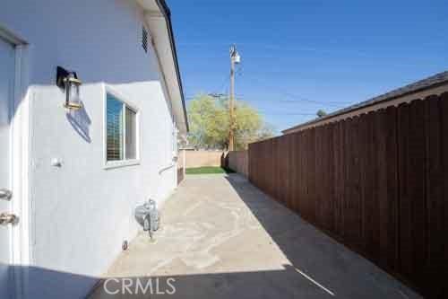 45522 Andale Ave, Lancaster, CA 93535 - view of side of property featuring fence and stucco siding
