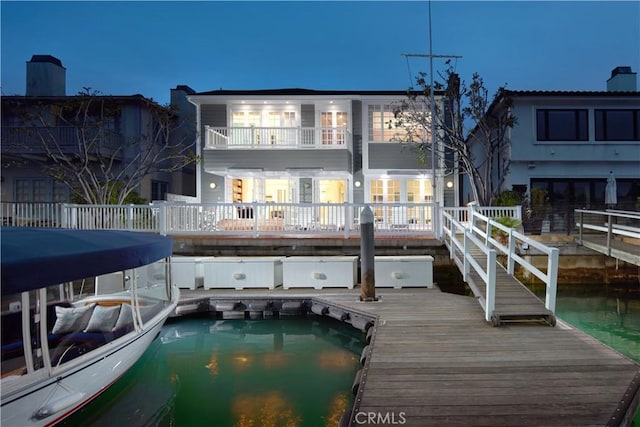736 Harbor Island Dr, Newport Beach, CA 92660 - back of house at night featuring a balcony