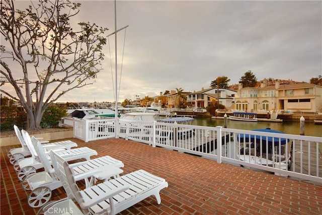 736 Harbor Island Dr, Newport Beach, CA 92660 - view of patio with a dock, a residential view, and a water view