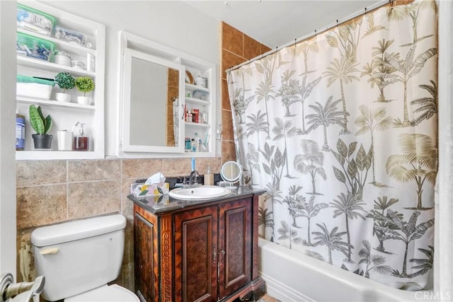 bathroom featuring toilet, shower / bathtub combination with curtain, vanity, and tile walls