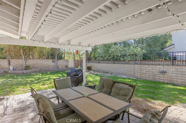 view of patio / terrace with grilling area, a fenced backyard, and outdoor dining area