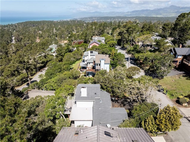 aerial view featuring a wooded view