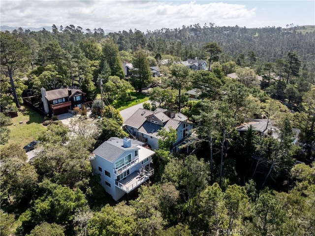 drone / aerial view with a view of trees