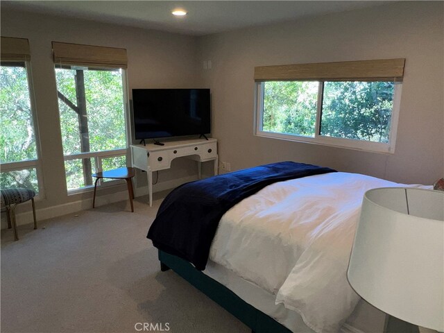 bedroom with carpet floors and recessed lighting