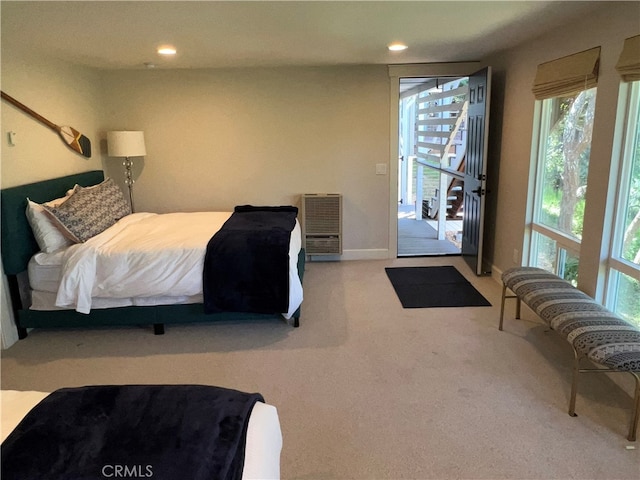 carpeted bedroom featuring access to outside, recessed lighting, and multiple windows