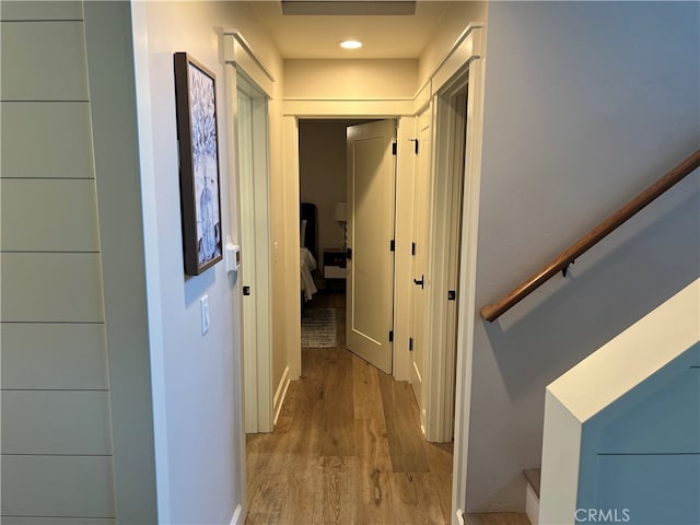 corridor featuring recessed lighting and wood finished floors