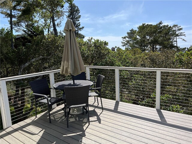 deck featuring outdoor dining area