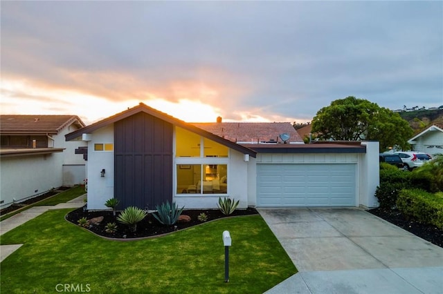 625 Calle Miguel, San Clemente, CA 92672 - view of front facade with an attached garage, a yard, driveway, and board and batten siding