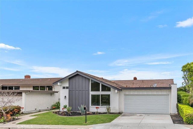 625 Calle Miguel, San Clemente, CA 92672 - view of front of home featuring a garage, driveway, a chimney, and a front yard