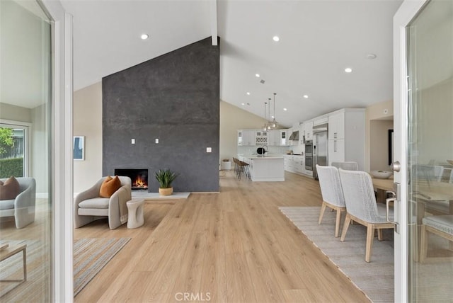 625 Calle Miguel, San Clemente, CA 92672 - living area with high vaulted ceiling, light wood-style flooring, a fireplace, beam ceiling, and recessed lighting