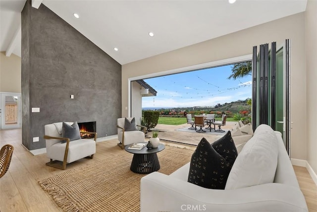 625 Calle Miguel, San Clemente, CA 92672 - living room featuring light wood-style floors, recessed lighting, a large fireplace, beam ceiling, and high vaulted ceiling