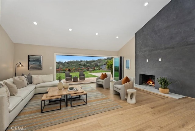 625 Calle Miguel, San Clemente, CA 92672 - living room featuring wood finished floors, high vaulted ceiling, a fireplace, and recessed lighting