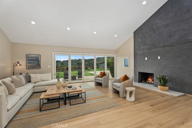 625 Calle Miguel, San Clemente, CA 92672 - living room with wood finished floors, a premium fireplace, recessed lighting, and high vaulted ceiling