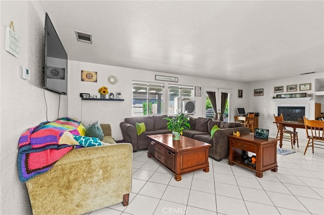 1509 Trinette Dr, Beaumont, CA 92223 - living room with a glass covered fireplace, light tile patterned floors, and visible vents