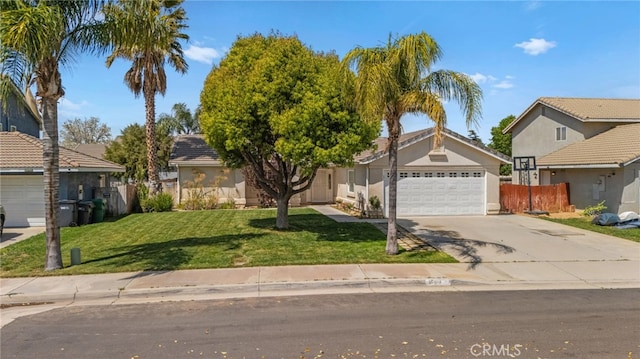 1509 Trinette Dr, Beaumont, CA 92223 - view of front of house with stucco siding, driveway, a front lawn, a garage, and fence